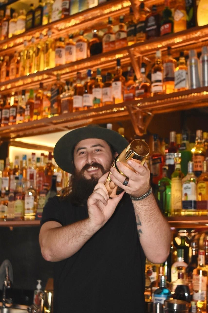 Bartender shaking a cocktail at Drunken Monkey Bar