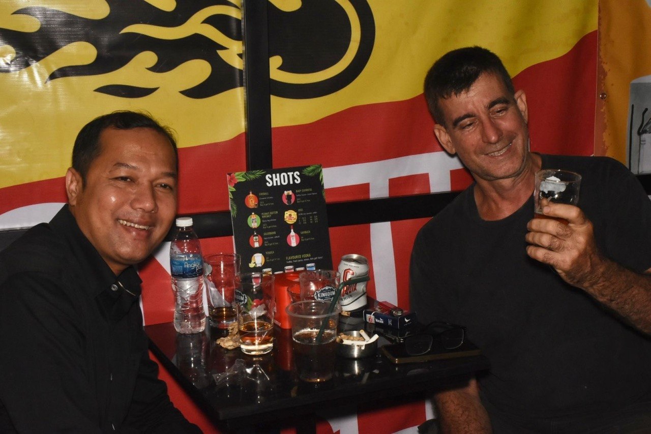 Guests having drinks together at Drunken Monkey Bar